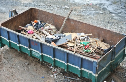 Frontline rubbish collection team preparing bins for commercial waste pickup